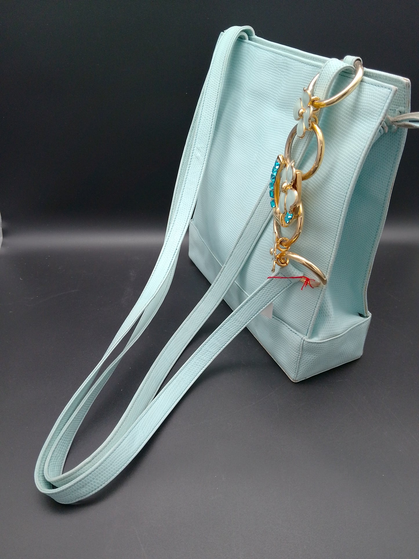 Gianni Versace Lederhandtasche in hellblau Reptildruck mit Hufeisen und kleeblatt