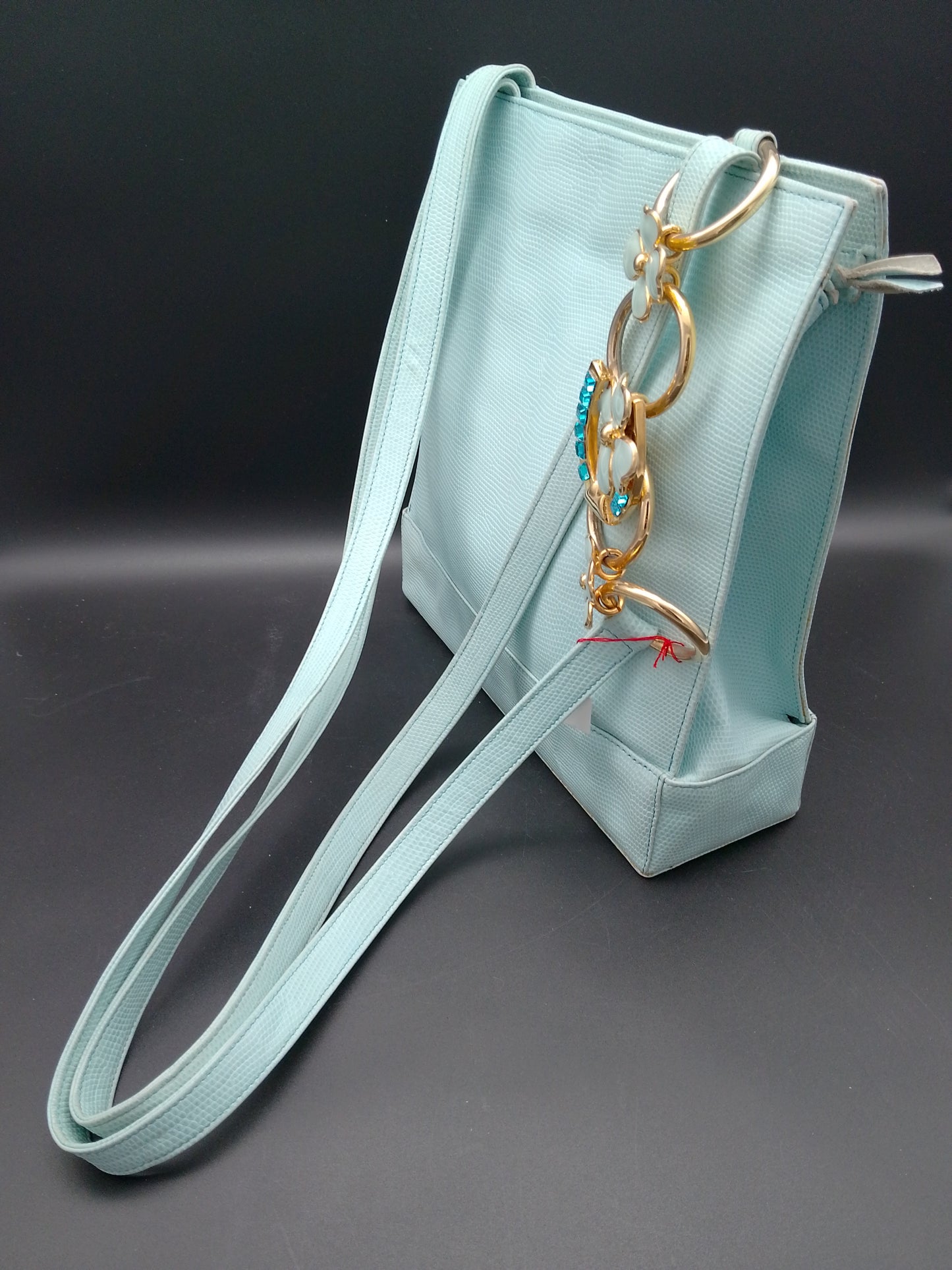 Gianni Versace Lederhandtasche in hellblau Reptildruck mit Hufeisen und kleeblatt